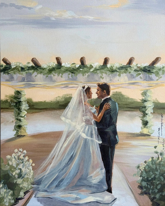 Pintura dos noivos se abraçando com o por do sol ao fundo.